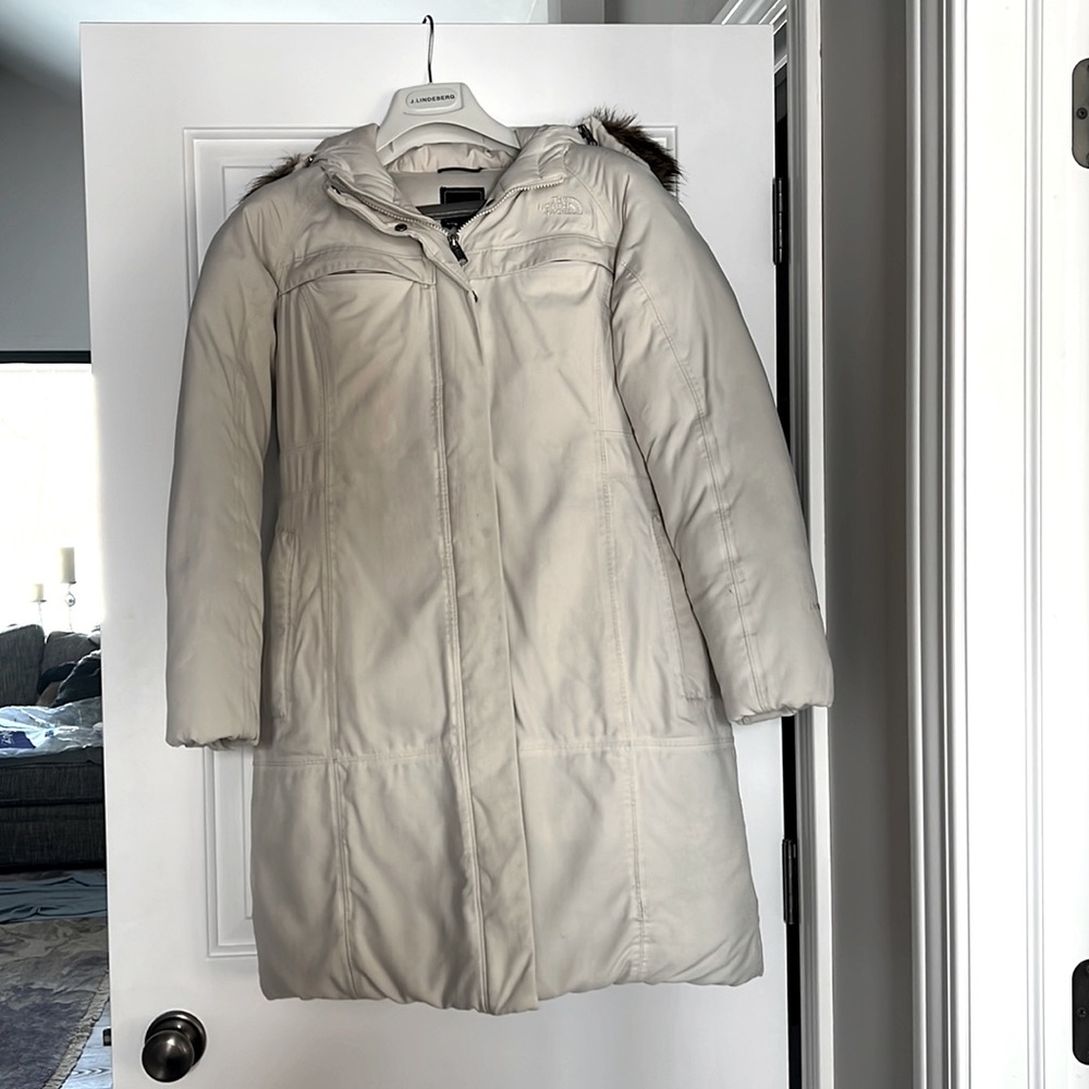 Cream North Face Coat with removable faux fur around the hood.